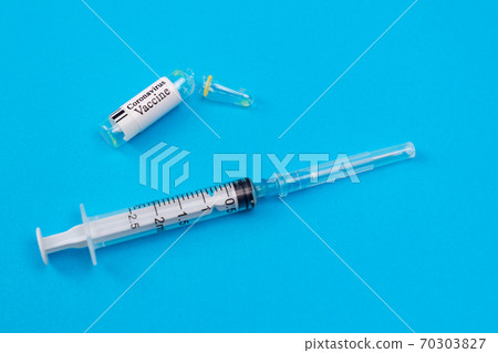 syringe and vaccine coronavirus blue background 70303827