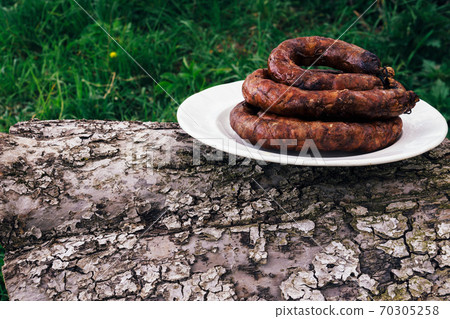 Grilled sausage in a white bowl Grilled sausage in a white bowl 70305258