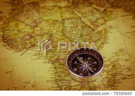 Compass on a vintage world map. Retro style 70305683