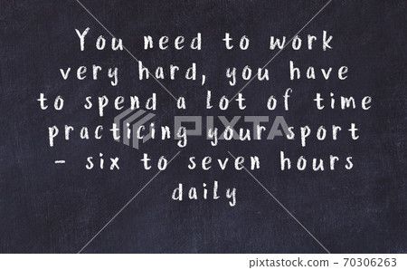 Black chalkboard with wise inscription on it Black chalkboard with wise inscription on it 70306263