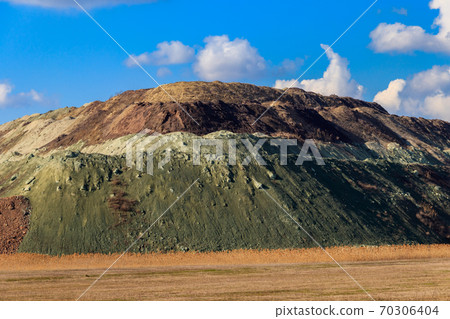 View of slag heaps of iron ore quarry. Mining industry View of slag heaps of iron ore quarry. Mining industry 70306404