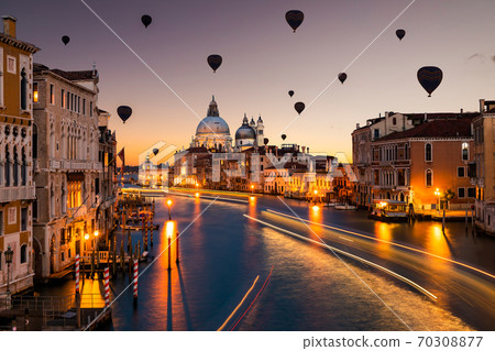 Hot air balloon over Grand Canal and Basilica Santa Maria della Salute, Venice, Italy. 70308877