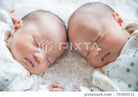 Twin Newborn Photo White background face up 70309531