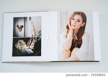 open wedding photo book. open wedding photo book. 70309663