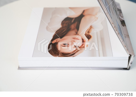 flipping through wedding photo book flipping through wedding photo book 70309738
