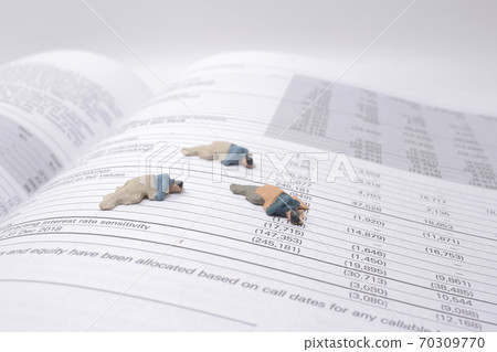 a social theme. Hungry homeless figure men on the book 70309770