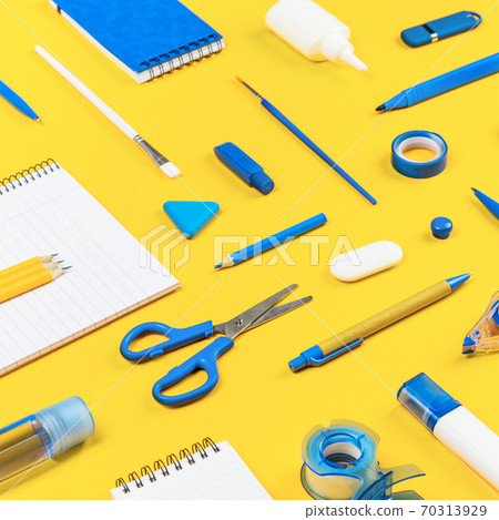 Assorted office and school white and blue stationery on yellow 70313929