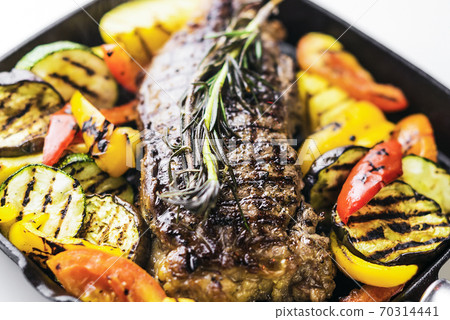 greek organic lamb steak with vegetables and herbs in skillet greek organic lamb steak with vegetables and herbs in skillet 70314441