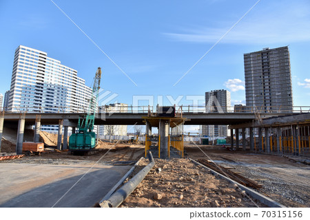 Roundabout and traffic bridge construction.  70315156