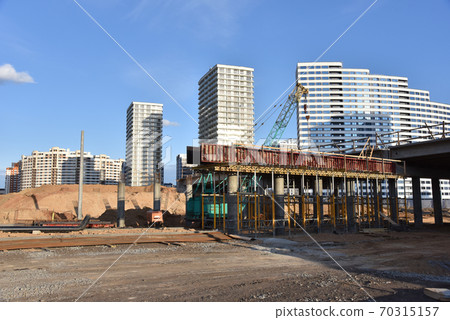 Roundabout and traffic bridge construction. Construction highway ramps and bridgeworks.  70315157