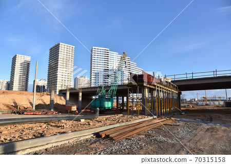 Roundabout and traffic bridge construction. Construction highway ramps and bridgeworks.  70315158