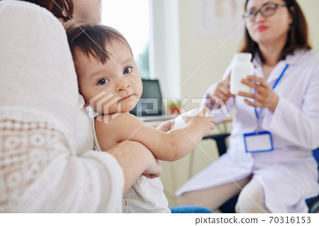 Girl in pediatricians office 70316153