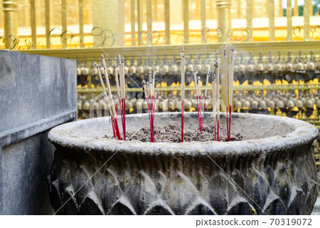 Incense sticks burning in old pot in the temple for worship of buddha 70319072