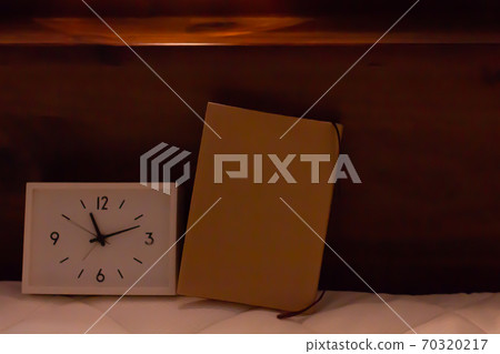 Reading in bed at night 70320217