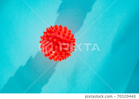 COVID-19 model of Coronavirus disease on blue COVID-19 model of Coronavirus disease on blue 70320448