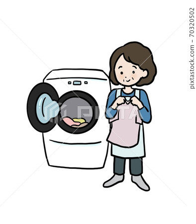 Woman washing in a drum-type washing machine 70320502