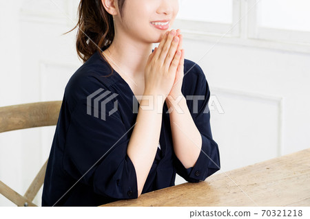 A young woman asking 70321218