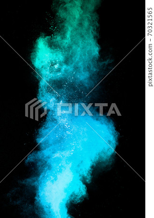 Launched blue dust particles splashing.Bizarre forms of blue powder explosion cloud on white background. Launched blue dust particles splashing.Bizarre forms of blue powder explosion cloud on white background. 70321565