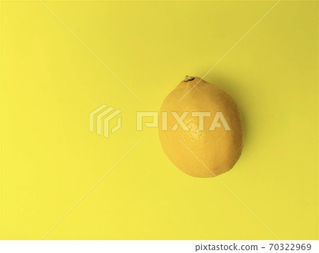 Yellow lemon on yellow background 70322969