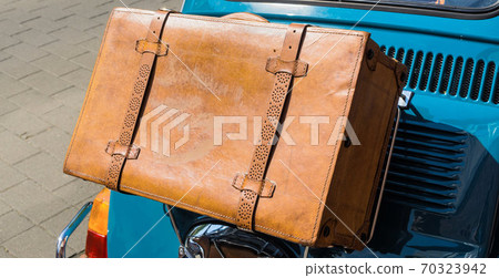 Antique brown leather case on the bridge at the bonnet Antique brown leather case on the bridge at the bonnet 70323942
