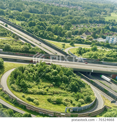 Aerial view from a small aircraft on the motorway Aerial view from a small aircraft on the motorway 70324668