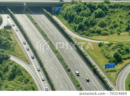 Aerial view from a small aircraft on the motorway Aerial view from a small aircraft on the motorway 70324669