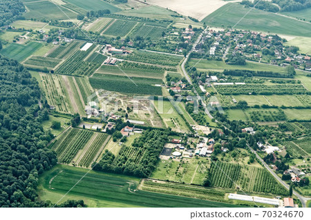 Urban sprawl in the north of Germany with small farmland 70324670