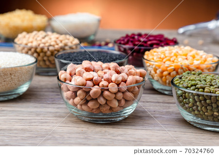 Peanuts in a bowl wood table. Peanuts in a bowl wood table. 70324760