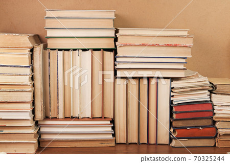 Heaps of various paper books Heaps of various paper books 70325244
