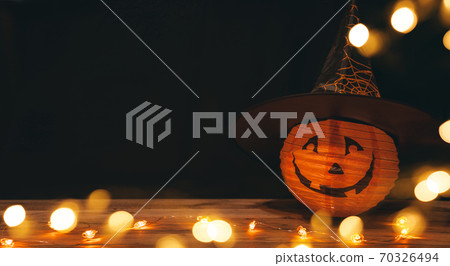 Original decorations with pumpkins and halloween witch hats on rustic wooden background. Original decorations with pumpkins and halloween witch hats on rustic wooden background. 70326494