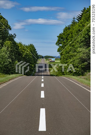 A straight road in Hokkaido A straight road in Hokkaido 70328196