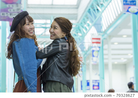 A woman walking in the city 70328627