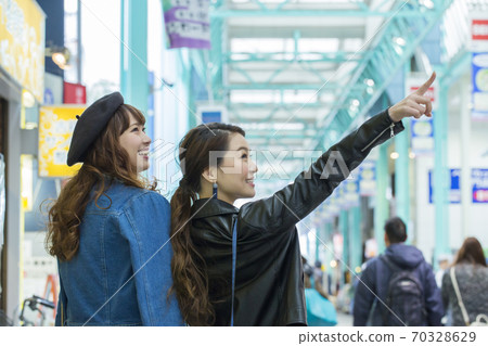 A woman walking in the city A woman walking in the city 70328629