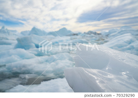 Climate Change. Iceberg afrom glacier in arctic nature landscape on Greenland. Icebergs in Ilulissat icefjord. Famously affected by global warming Climate Change. Iceberg afrom glacier in arctic nature landscape on Greenland. Icebergs in Ilulissat icefjord. Famously affected by global warming 70329290