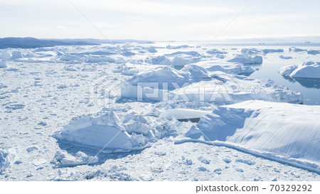 Drone photo of Iceberg and ice from glacier in arctic nature landscape on Greenland. Aerial photo drone photo of icebergs in Ilulissat icefjord. Affected by climate change and global warming Drone photo of Iceberg and ice from glacier in arctic nature landscape on Greenland. Aerial photo drone photo of icebergs in Ilulissat icefjord. Affected by climate change and global warming 70329292