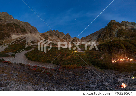 Karasawa Cirque and Hotaka Mountain Range Starry Sky in Autumn Colors Illuminated by Moonlight Karasawa Cirque and Hotaka Mountain Range Starry Sky in Autumn Colors Illuminated by Moonlight 70329504