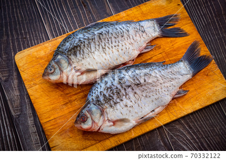 raw cleaned from scales, fish river carp 70332122