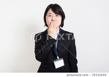 Business woman hiding mouth Business woman hiding mouth 70332644
