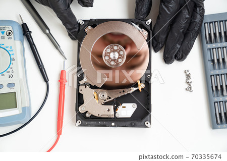 open Computer Hard Drive. screwdriver set. Hands. open Computer Hard Drive. screwdriver set. Hands. 70335674