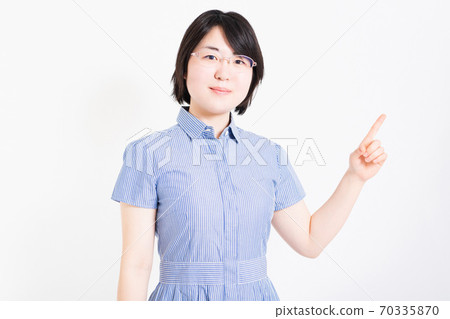 Woman showing point with her index finger Woman showing point with her index finger 70335870