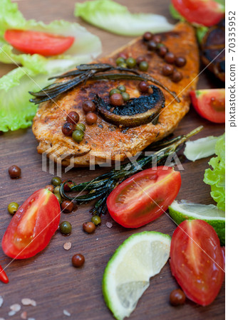 wood fired hoven cooked chicken breast on wood board wood fired hoven cooked chicken breast on wood board 70335952