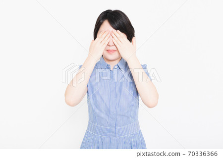 Woman hiding her eyes 70336366
