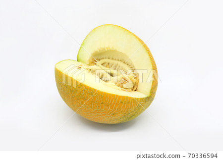 Cut ripe melon with seeds close-up on white background 70336594