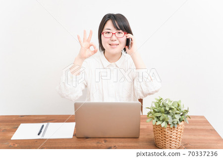 Woman using a laptop Woman using a laptop 70337236