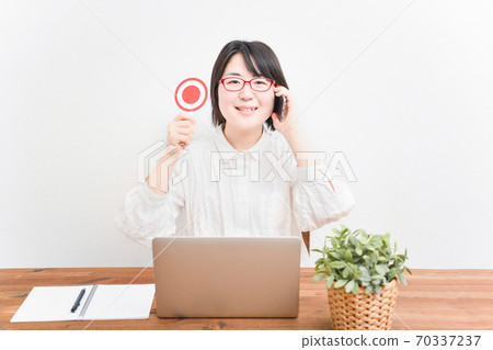 Woman using a laptop Woman using a laptop 70337237
