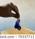 Male hand holding a keys Male hand holding a keys 70337711