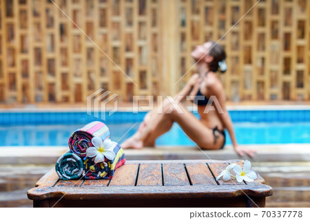 Slim and suntanned woman on a background travel Slim and suntanned woman on a background travel 70337778