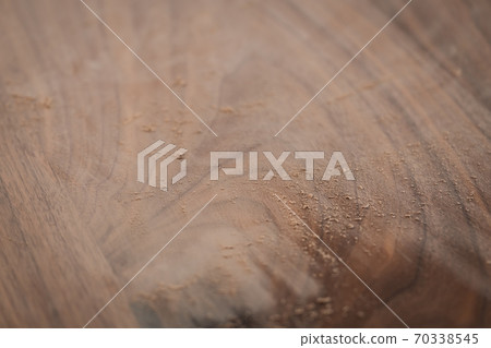 Black walnut table with dust from sanding 70338545
