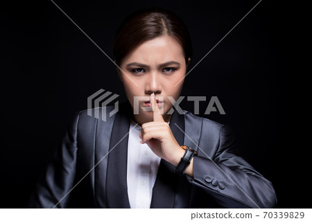 Woman make be quiet gesture 70339829