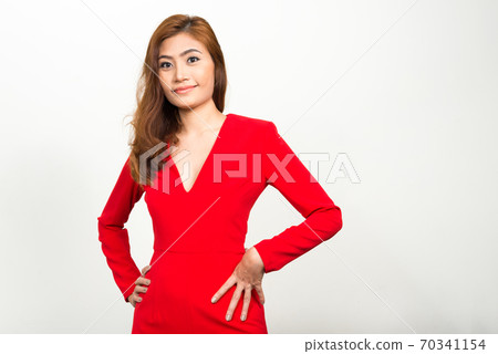 Portrait of young beautiful Asian businesswoman looking at camera Portrait of young beautiful Asian businesswoman looking at camera 70341154
